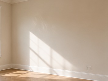 Freshly painted interior room with crisp cut lines at the ceiling and baseboard